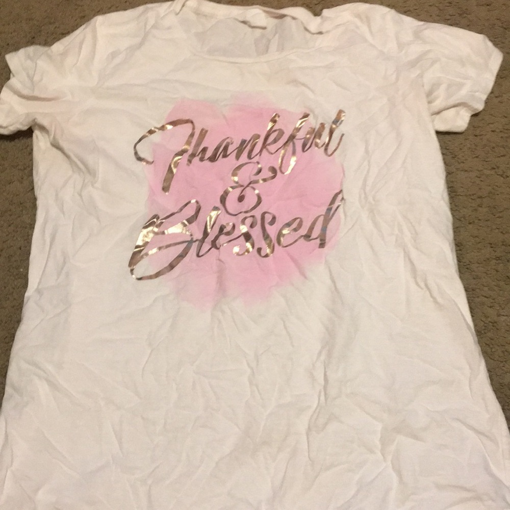 White shirt with words “thankful & blessed”